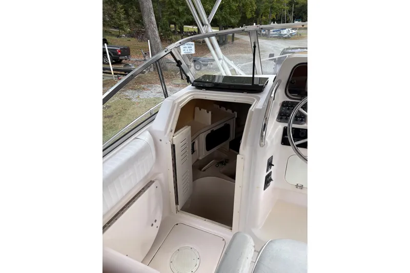 Slide: The Image of 2001 Grady-White Express 265 boat interior with helm and cabin entrance. - 37