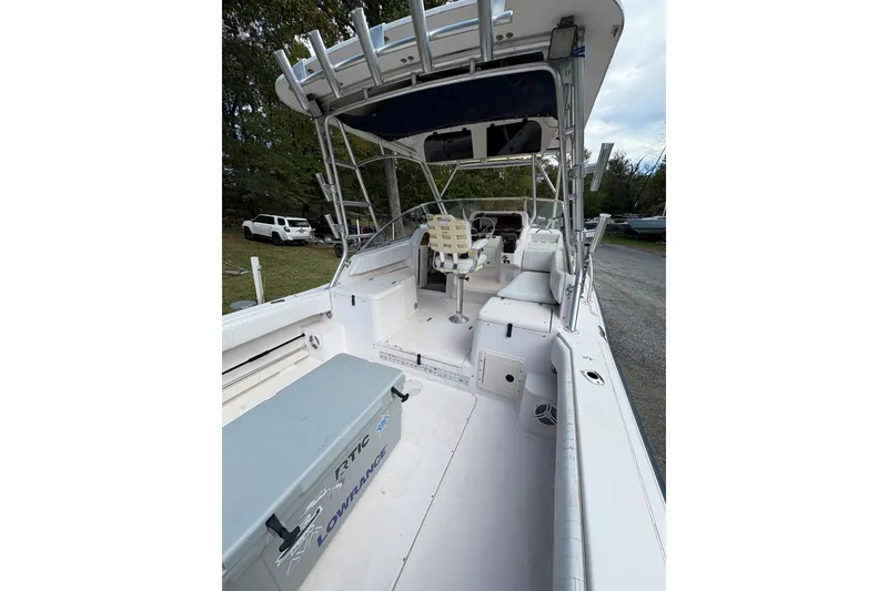 Slide: The Image of 2001 Grady-White Express 265 boat interior with seating and equipment, parked outdoors. - 43