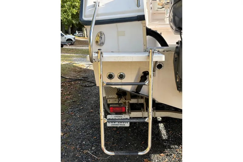 Slide: The Image of 2001 Grady-White Express 265 boat stern with ladder and trailer. - 45