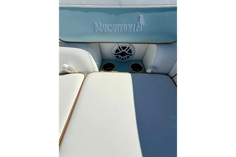 Slide: The Image of Berkshire 22RFX CHILL 2026 boat seating with Margaritaville logo and speaker. - 14