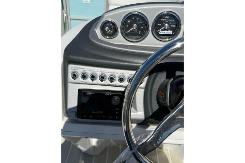 Slide: The Image of Dashboard of 2026 Berkshire 22RFX CHILL boat with gauges and controls. - 19