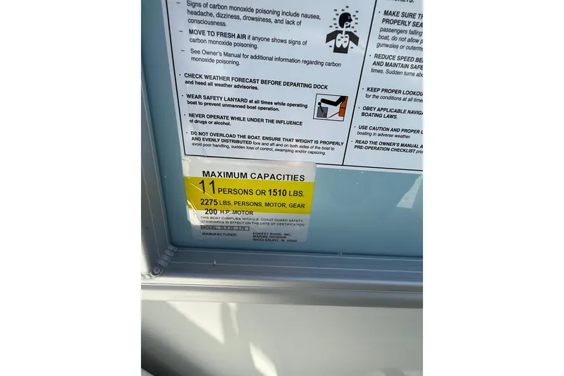 Slide: The Image of Capacity warning label on 2026 Berkshire 22RFX CHILL boat, max 11 persons or 1510 lbs. - 22