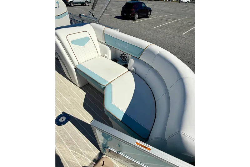 Slide: The Image of Luxurious seating on 2026 Berkshire 22RFX CHILL pontoon boat in a parking lot. - 8
