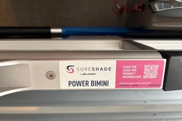 Slide: The Image of SureShade Power Bimini on 2023 Sun Tracker SportFish 20 DLX with QR code for product info. - 7