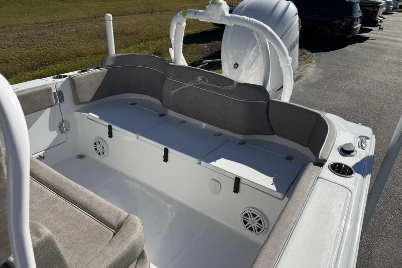 Slide: The Image of 2026 Sea Hunt Ultra 245 SE boat interior with cushioned seating and storage compartments. - 12