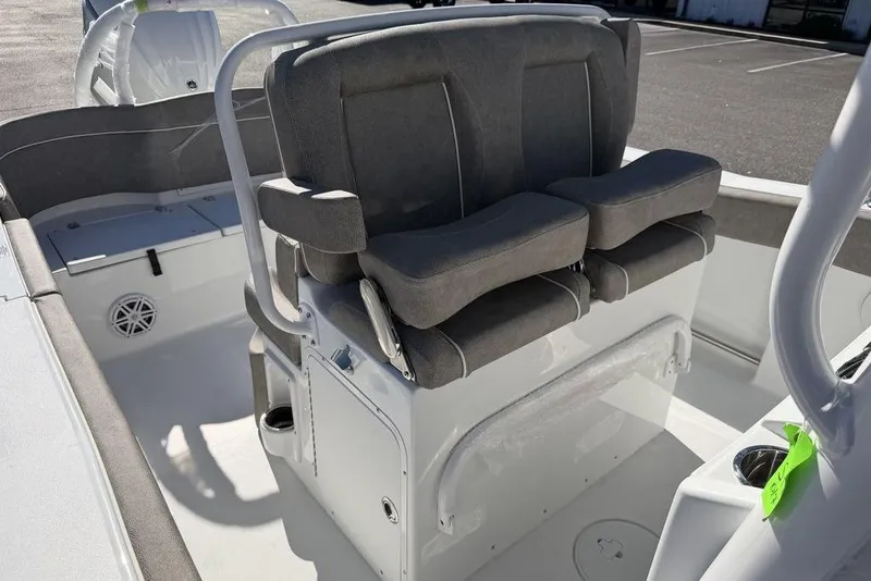 Slide: The Image of 2026 Sea Hunt Ultra 245 SE boat interior with cushioned seating and storage compartments. - 13