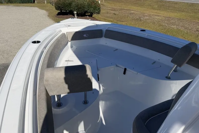 Slide: The Image of 2026 Sea Hunt Ultra 245 SE boat interior with seating and storage compartments. - 14