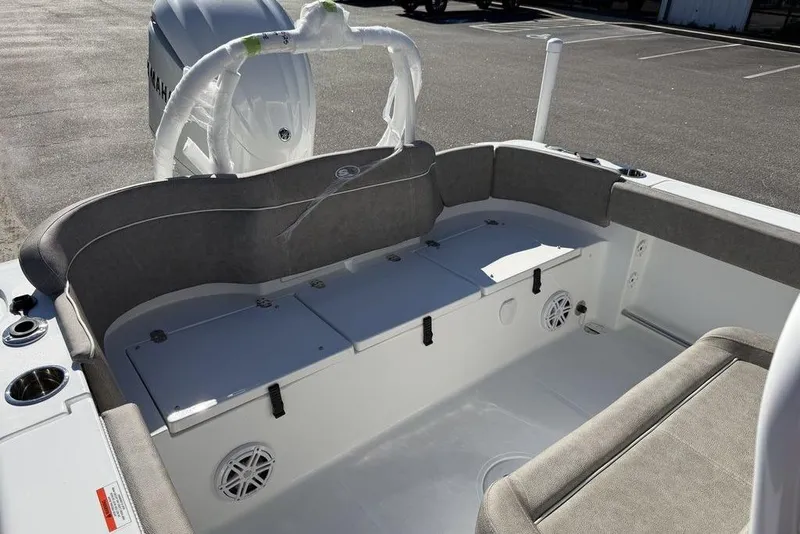 Slide: The Image of 2026 Sea Hunt Ultra 245 SE boat interior with cushioned seating and storage compartments. - 15