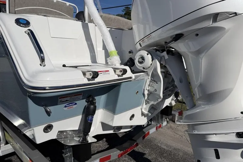 Slide: The Image of 2026 Sea Hunt Ultra 245 SE boat with outboard motor, rear view. - 22