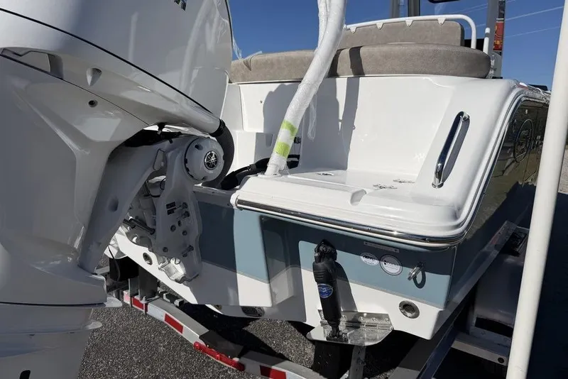 Slide: The Image of 2026 Sea Hunt Ultra 245 SE boat with Yamaha outboard motor on trailer. - 23