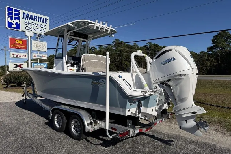 Slide: The Image of 2026 Sea Hunt Ultra 245 SE boat on trailer at Marine Service Center. - 4
