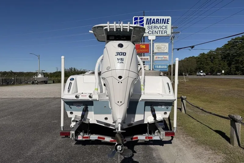 Slide: The Image of 2026 Sea Hunt Ultra 245 SE boat with Yamaha 300 V6 engine at marine service center. - 6