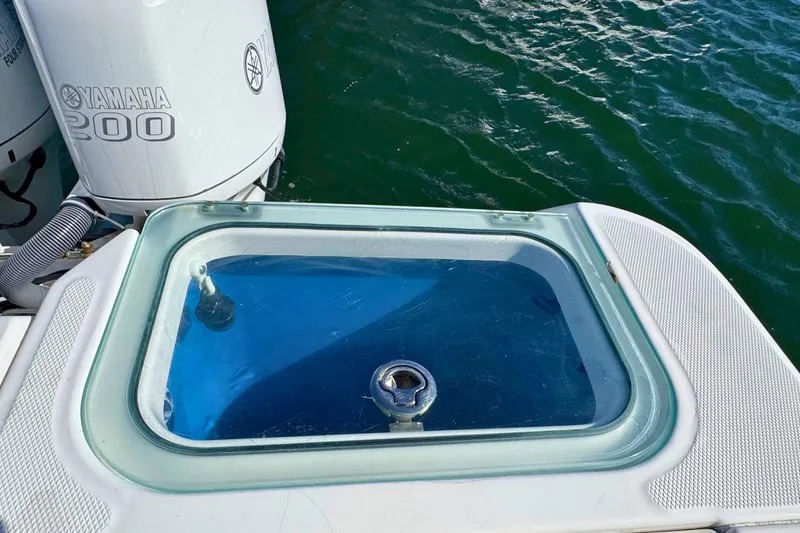 Slide: The Image of 2015 Everglades 255 Center Console with Yamaha 200 engine, featuring a livewell. - 10