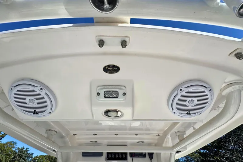 Slide: The Image of 2015 Everglades 255 Center Console boat roof with speakers and lighting fixtures. - 12