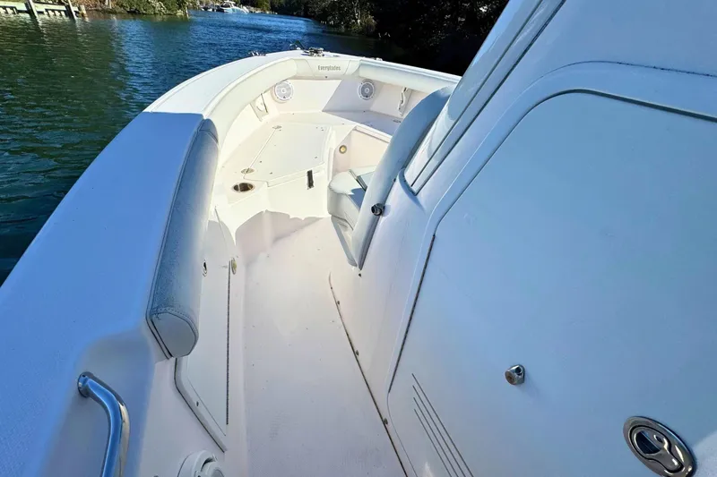 Slide: The Image of 2015 Everglades 255 Center Console boat interior with seating and storage. - 18