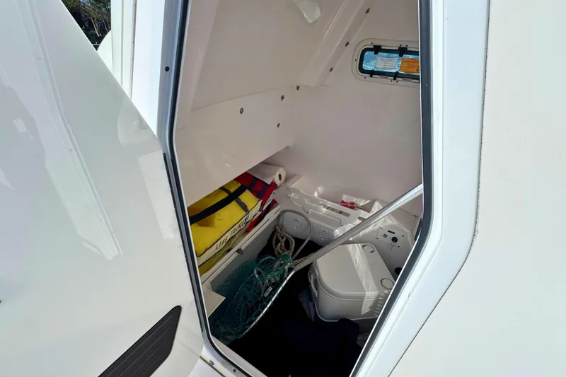 Slide: The Image of Interior view of 2015 Everglades 255 Center Console boat storage compartment. - 19