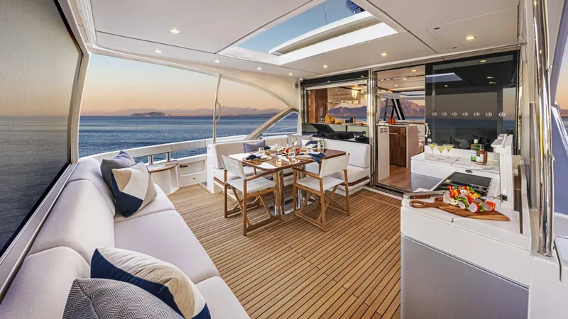 Slide: The Image of Luxurious 2025 Riviera 6800 Sport Yacht Platinum Edition with elegant deck and ocean view. - 16