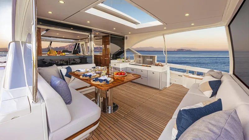 Slide: The Image of Luxurious 2025 Riviera 6800 Sport Yacht Platinum Edition with elegant interior and ocean view. - 17