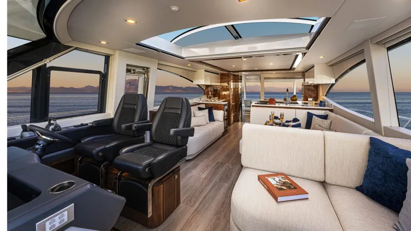 Slide: The Image of Luxurious interior of 2025 Riviera 6800 Sport Yacht Platinum Edition with ocean view. - 24