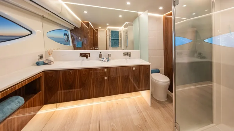 Slide: The Image of Luxurious bathroom in 2025 Riviera 6800 Sport Yacht Platinum Edition, featuring modern design and elegant finishes. - 30