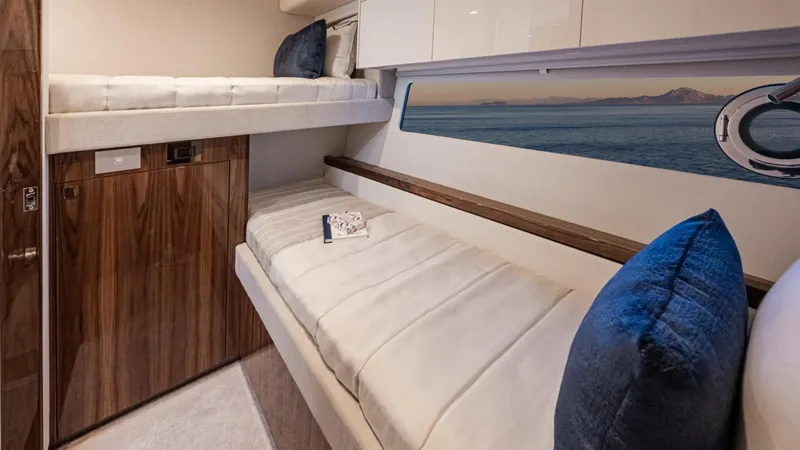 Slide: The Image of Luxurious cabin interior of 2025 Riviera 6800 Sport Yacht Platinum Edition. - 34