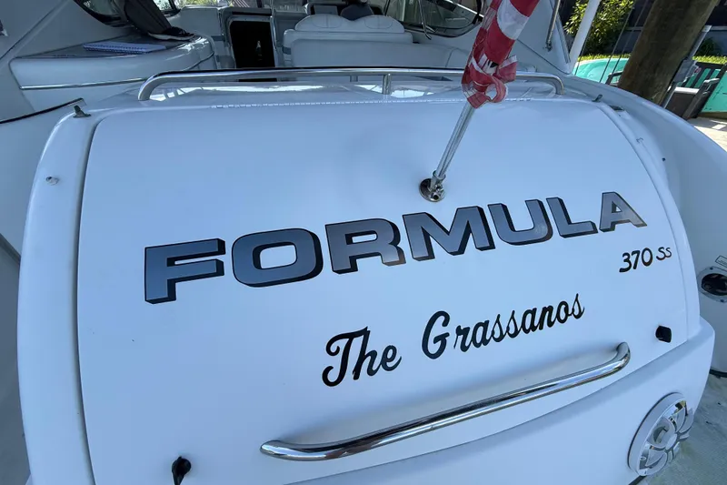 Slide: The Image of 2004 Formula 370 Super Sport boat with custom name "The Grassanos" on the stern. - 10