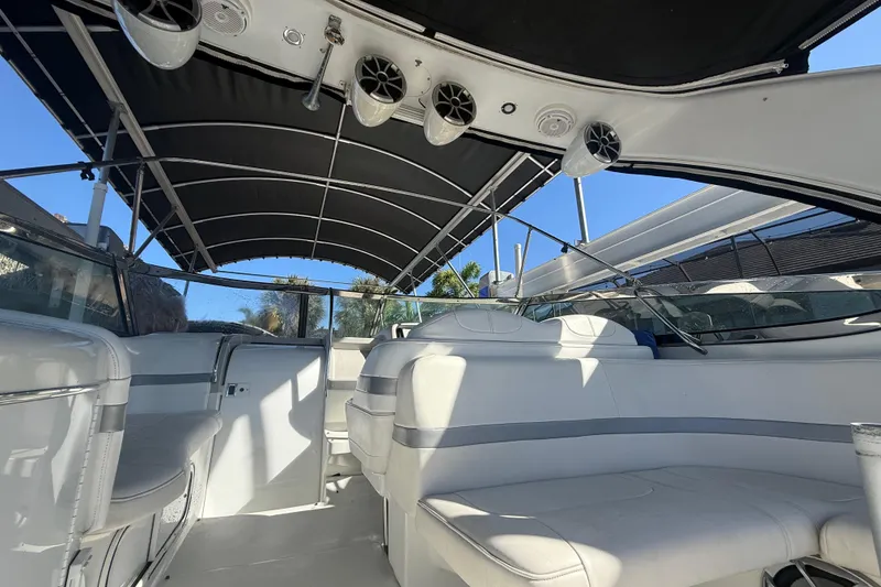 Slide: The Image of Interior view of a 2004 Formula 370 Super Sport boat with seating and canopy. - 12