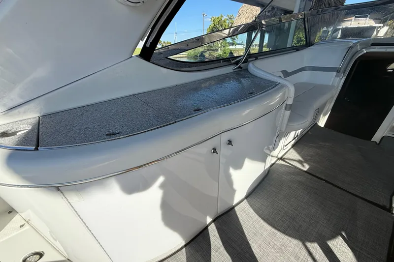 Slide: The Image of Interior view of a 2004 Formula 370 Super Sport boat, featuring sleek design and seating. - 20