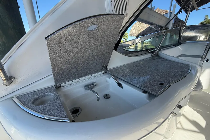 Slide: The Image of 2004 Formula 370 Super Sport boat interior with open sink and counter space. - 21