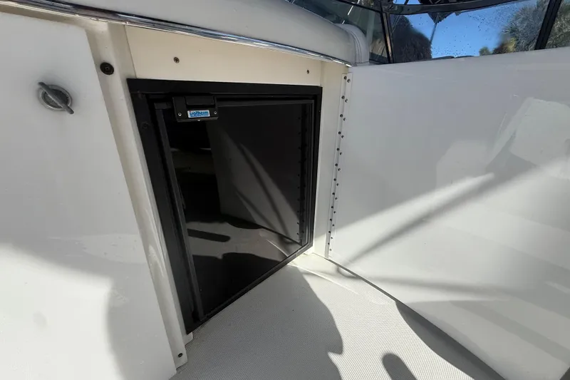 Slide: The Image of 2004 Formula 370 Super Sport boat interior with a built-in refrigerator. - 22
