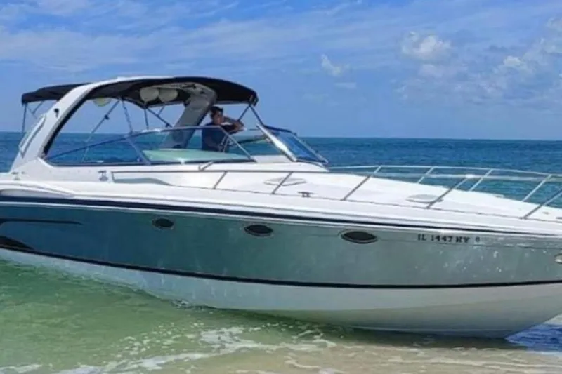 Slide: The Image of 2004 Formula 370 Super Sport boat cruising on clear ocean waters. - 3