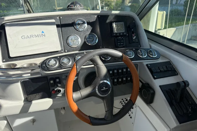 Slide: The Image of Dashboard of a 2004 Formula 370 Super Sport boat with Garmin navigation system. - 32