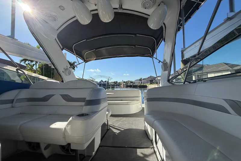 Slide: The Image of Interior view of a 2004 Formula 370 Super Sport boat with seating and canopy. - 33