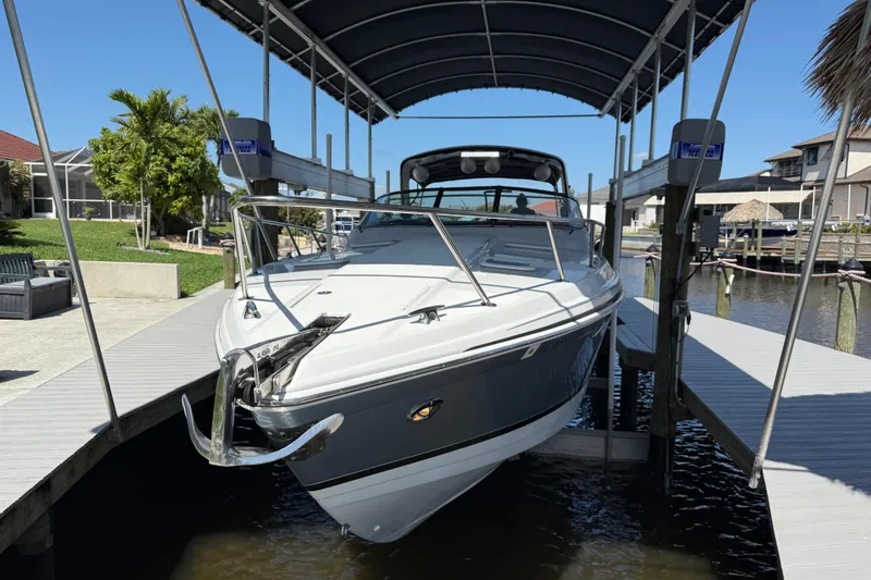 Slide: The Image of 2004 Formula 370 Super Sport boat docked under a covered lift. - 5