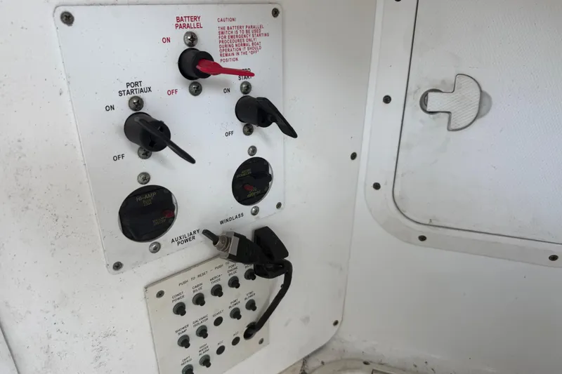 Slide: The Image of Control panel of a 2004 Formula 370 Super Sport boat with switches and dials. - 57