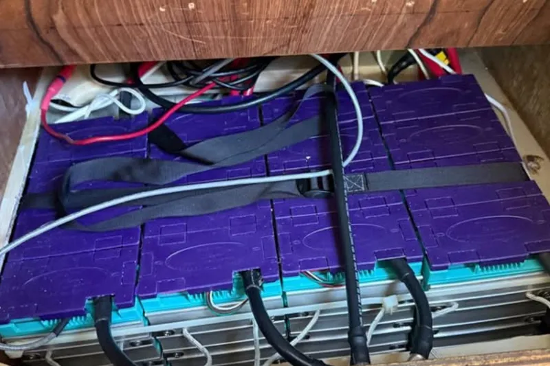 Slide: The Image of Battery setup in a 1981 Catalina 30 sailboat, featuring purple and blue components. - 12