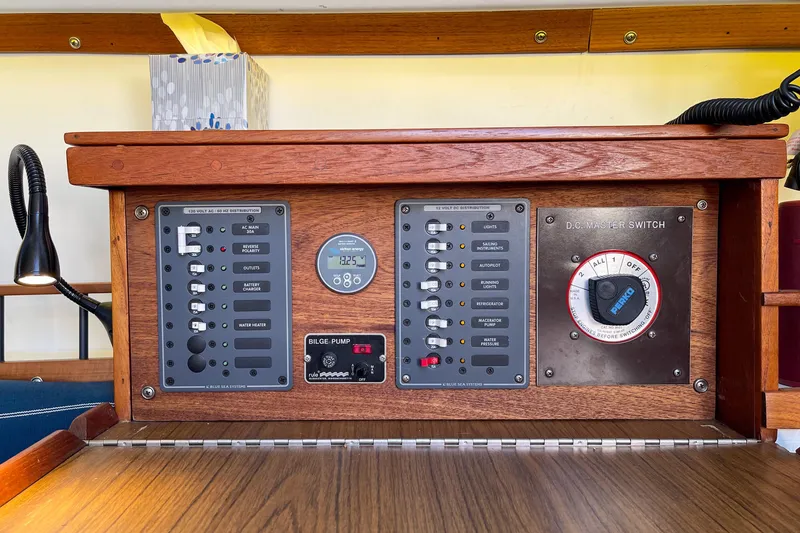 Slide: The Image of Electrical control panel of a 1981 Catalina 30 sailboat with switches and gauges. - 15