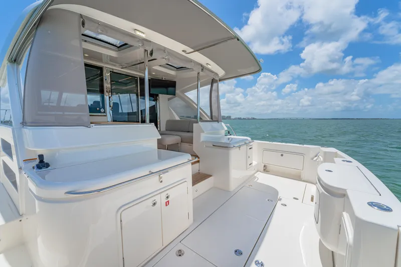 Slide: The Image of 2024 Riviera 505 SUV luxury yacht deck with ocean view. - 14