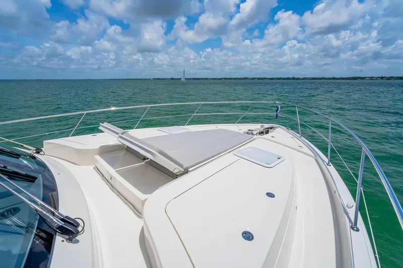 Slide: The Image of 2024 Riviera 505 SUV yacht bow on open water under blue sky. - 22