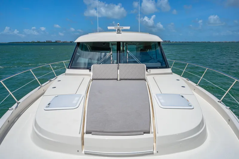 Slide: The Image of 2024 Riviera 505 SUV luxury yacht on open water. - 23