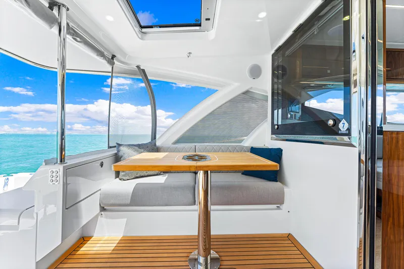 Slide: The Image of 2024 Riviera 505 SUV interior with ocean view and modern seating area. - 28