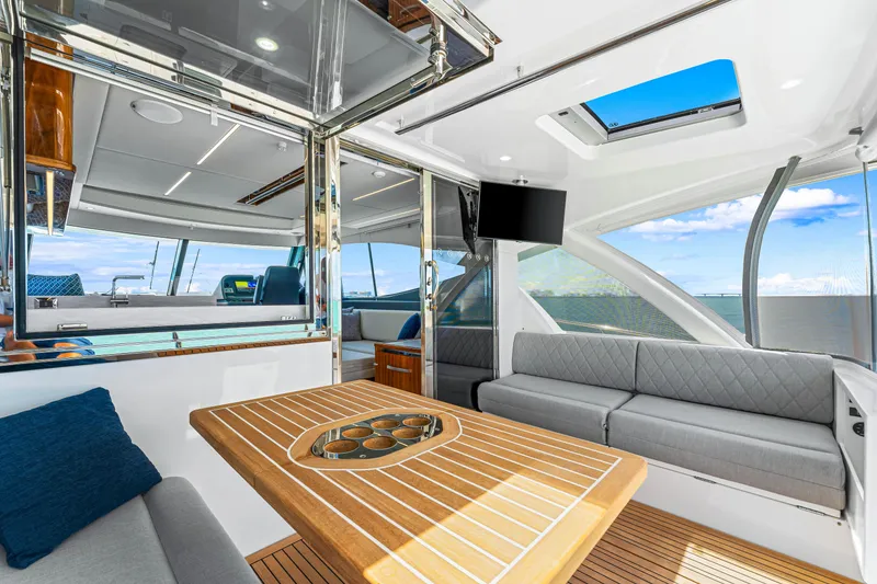 Slide: The Image of Luxurious interior of the 2024 Riviera 505 SUV yacht with modern furnishings and ocean view. - 32
