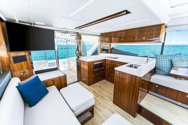 Slide: The Image of 2024 Riviera 505 SUV interior with modern kitchen and ocean view. - 36