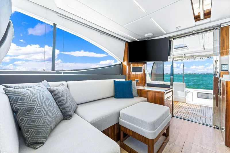 Slide: The Image of Luxurious interior of the 2024 Riviera 505 SUV yacht with ocean view. - 38