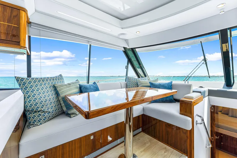 Slide: The Image of Luxurious interior of the 2024 Riviera 505 SUV yacht with ocean view. - 39