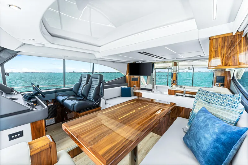 Slide: The Image of Luxurious interior of the 2024 Riviera 505 SUV yacht with ocean view. - 40