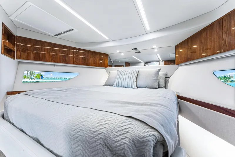 Slide: The Image of Luxurious bedroom interior of 2024 Riviera 505 SUV yacht with modern design. - 46
