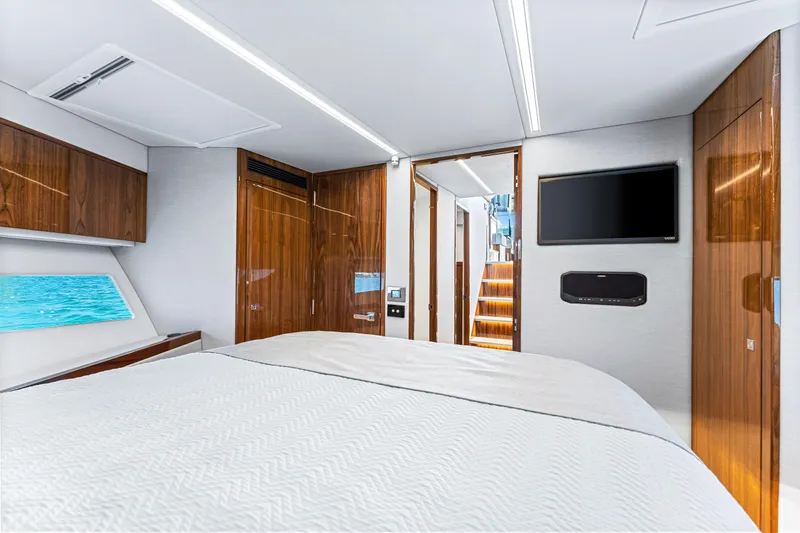 Slide: The Image of Luxurious bedroom interior of 2024 Riviera 505 SUV yacht with modern amenities. - 47