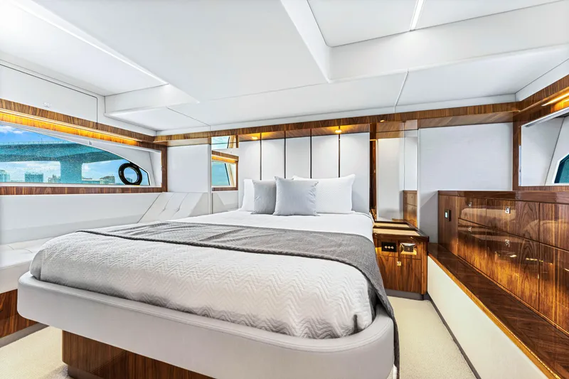 Slide: The Image of Luxurious bedroom interior of 2024 Riviera 505 SUV yacht with modern design. - 49