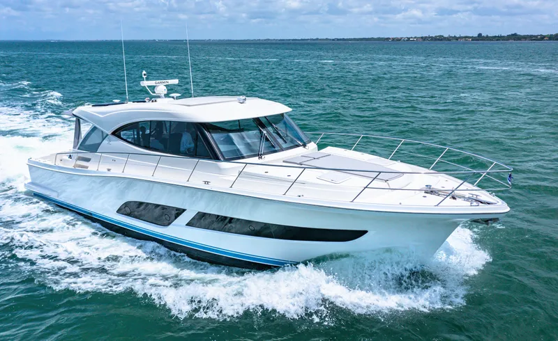 Slide: The Image of 2024 Riviera 505 SUV luxury yacht cruising on open water. - 5